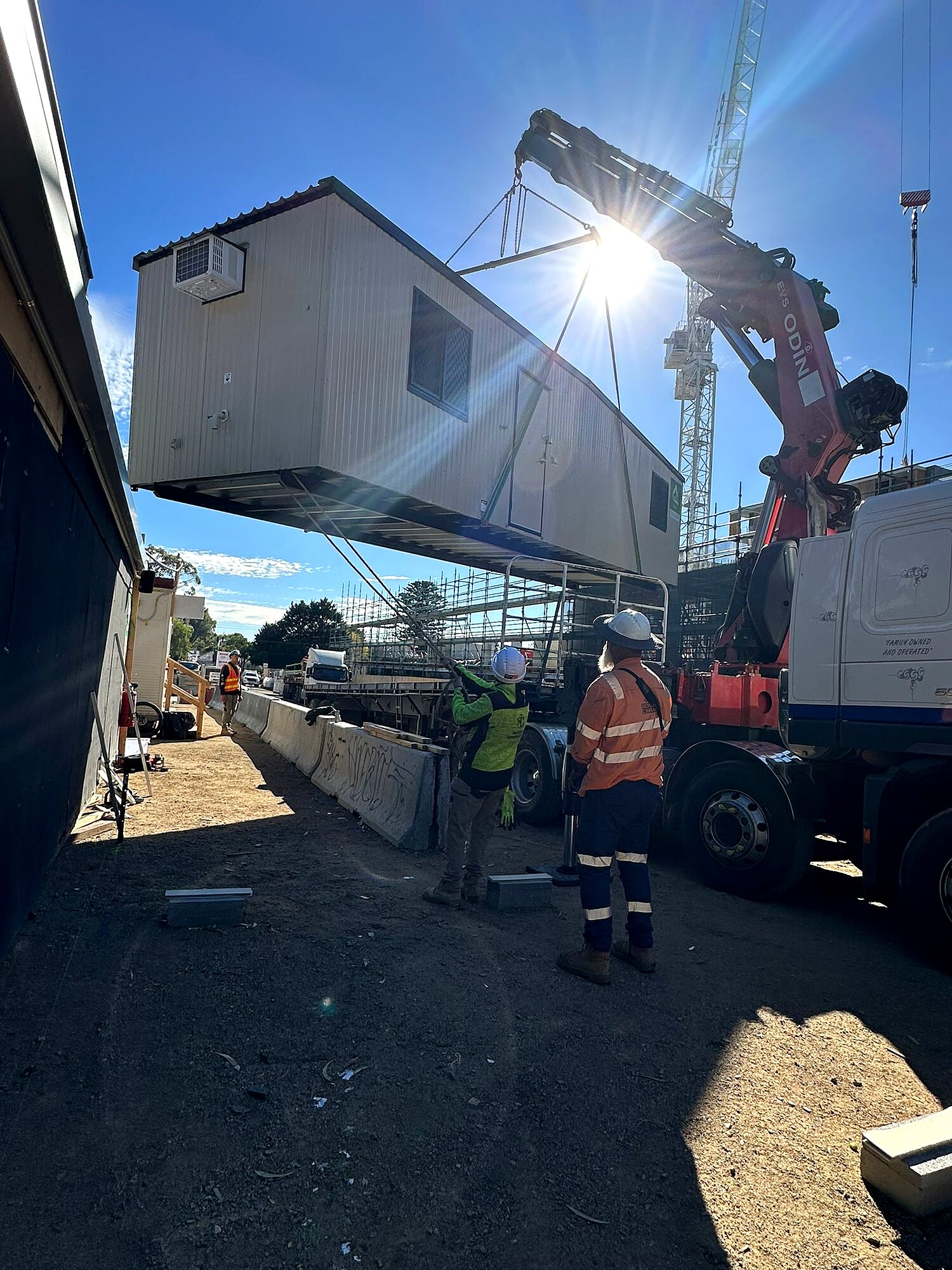 Crane lifting an Ausco modular building into position at the Ballarat site